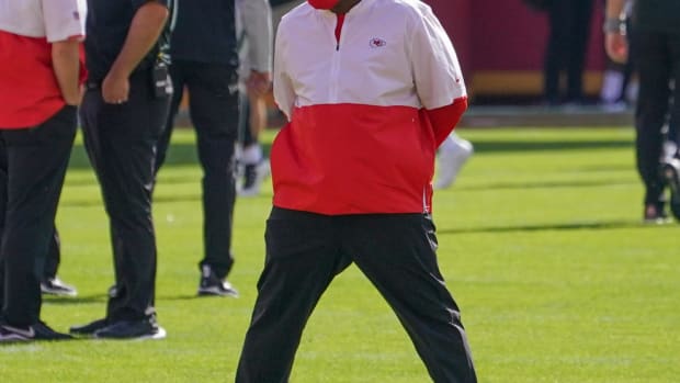 Oct 11, 2020; Kansas City, Missouri, USA; Kansas City Chiefs offensive coordinator Eric Bieniemy watches warm ups before the game against the Las Vegas Raiders at Arrowhead Stadium. Mandatory Credit: Denny Medley-USA TODAY Sports
